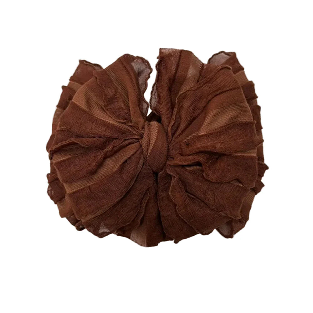 Brown hair scrunchie on a white background