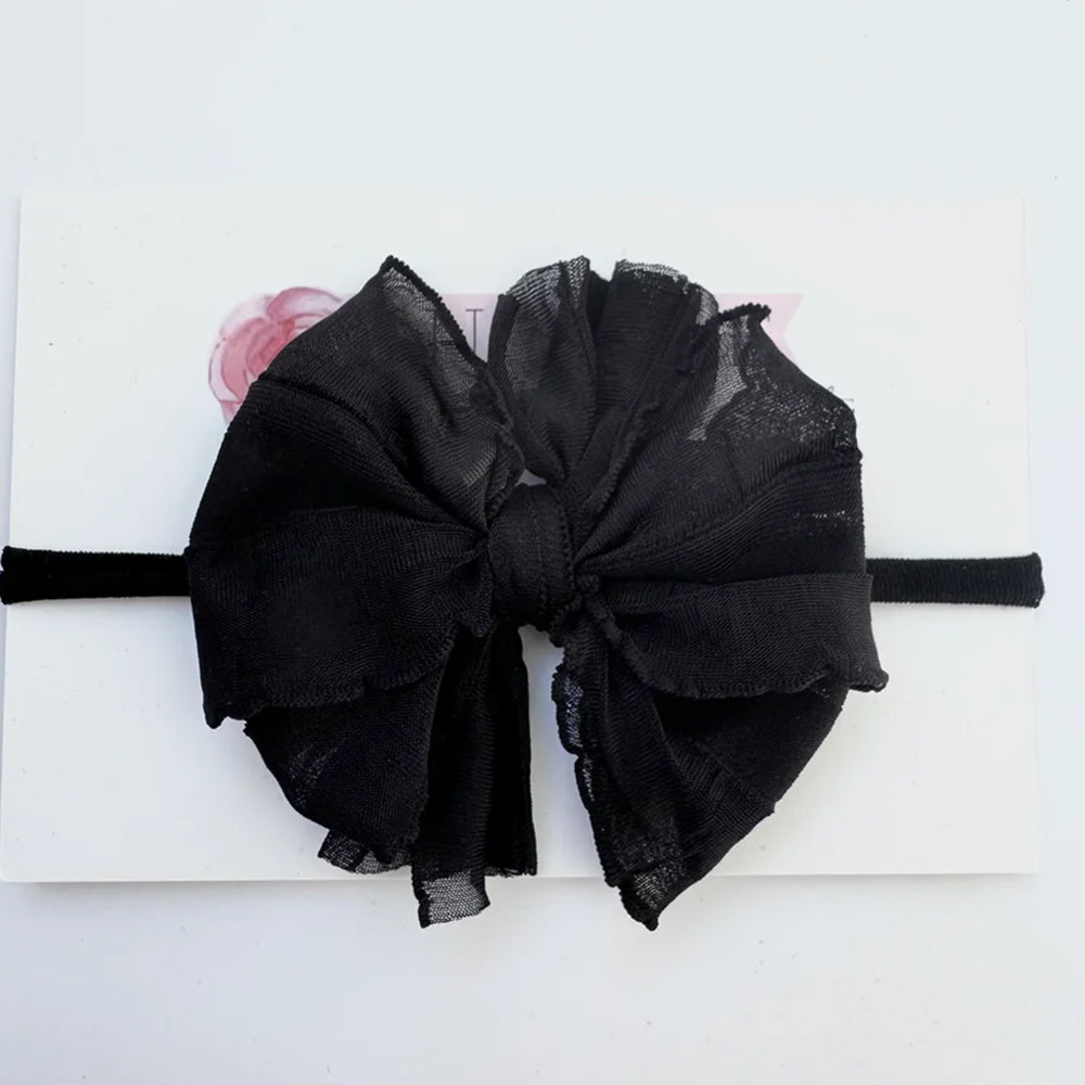 Black bow headband on a white background