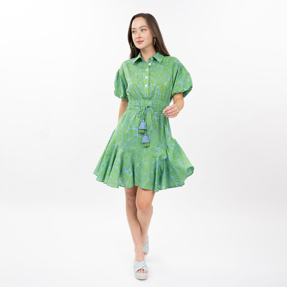 Woman wearing a green dress with a white background