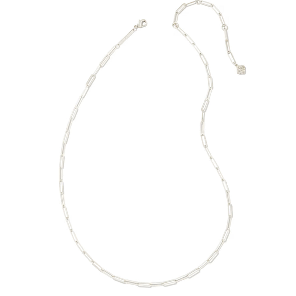 A delicate silver paperclip chain necklace with a lobster clasp and an adjustable extender chain featuring a small heart-shaped charm, displayed on a solid white background.