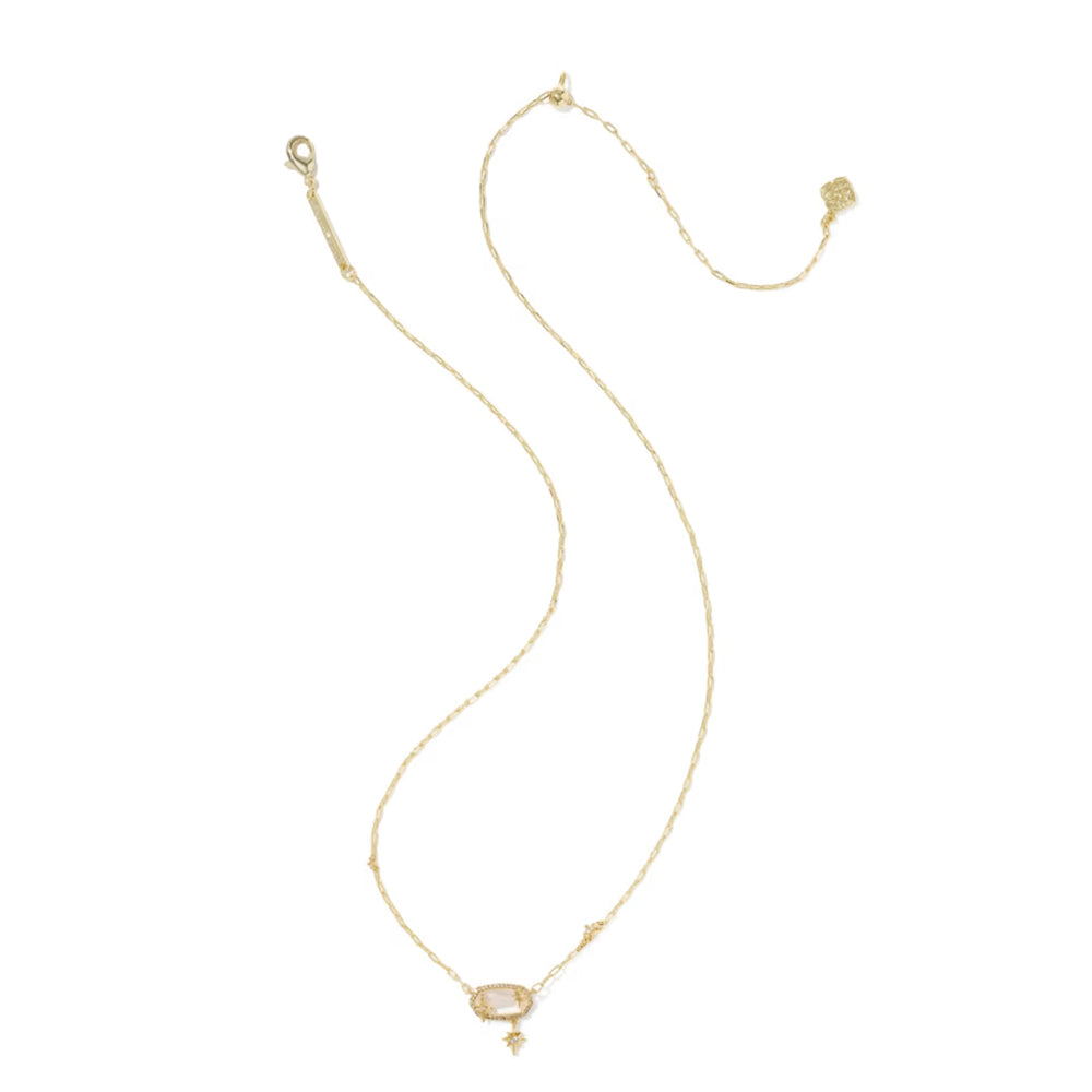 A delicate gold chain necklace with a small oval pale pinkish-beige center stone and a tiny dangling bead, displayed on a clean white background.