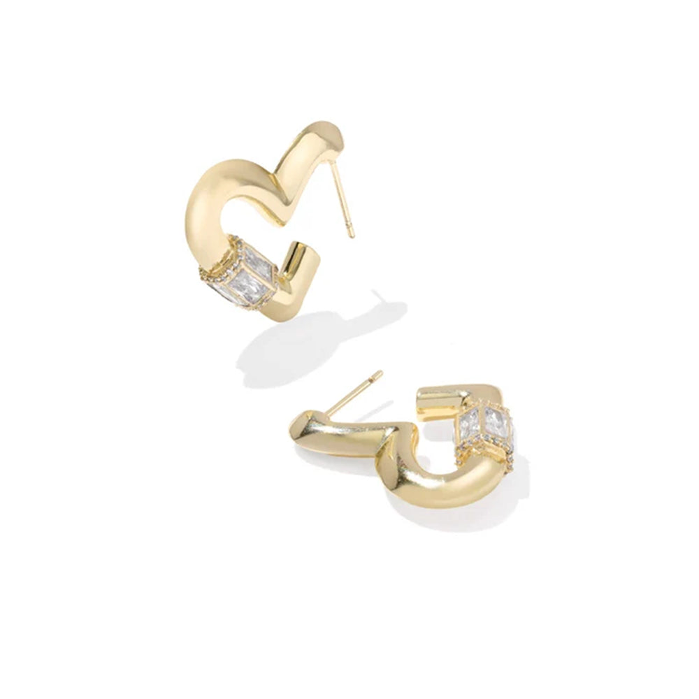 A pair of gold huggie hoop earrings with rectangular clear gemstones, shown on a clean white background.