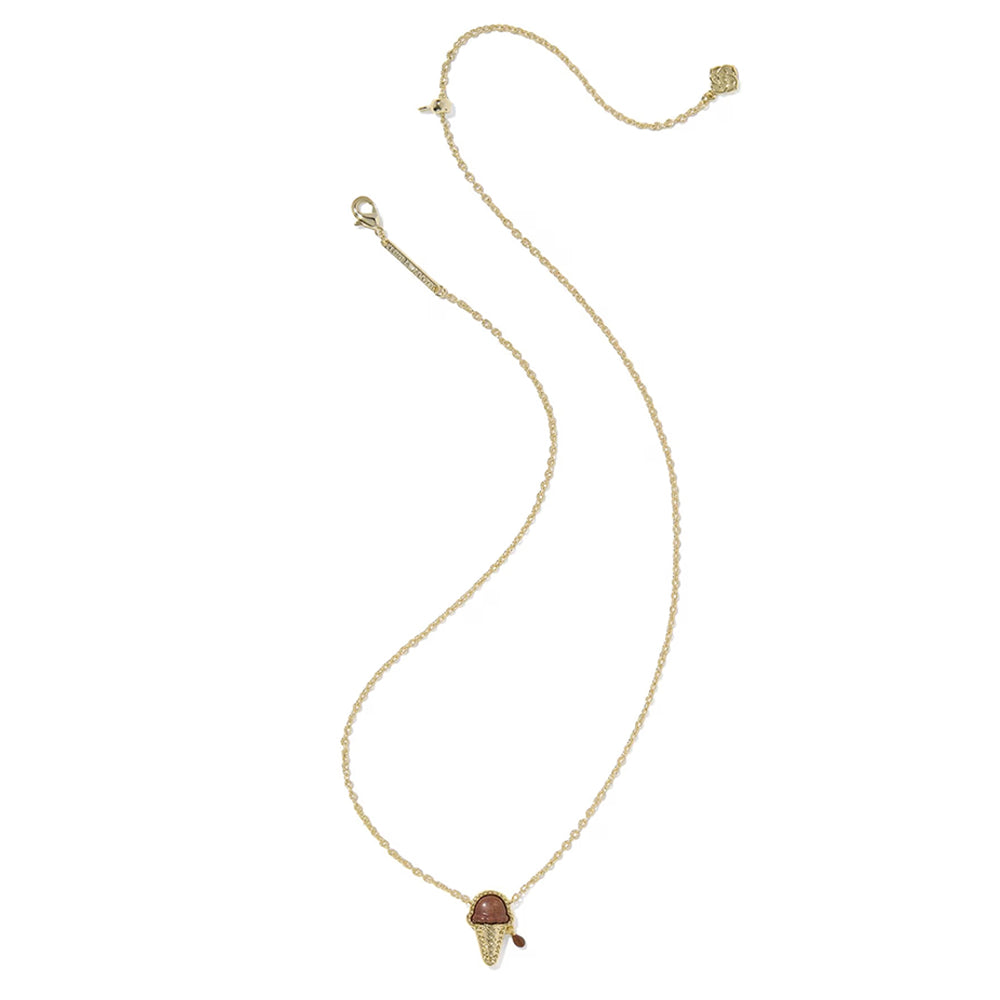 A delicate gold chain necklace featuring a small mushroom-shaped pendant with a reddish-brown cap, displayed on a clean white background.