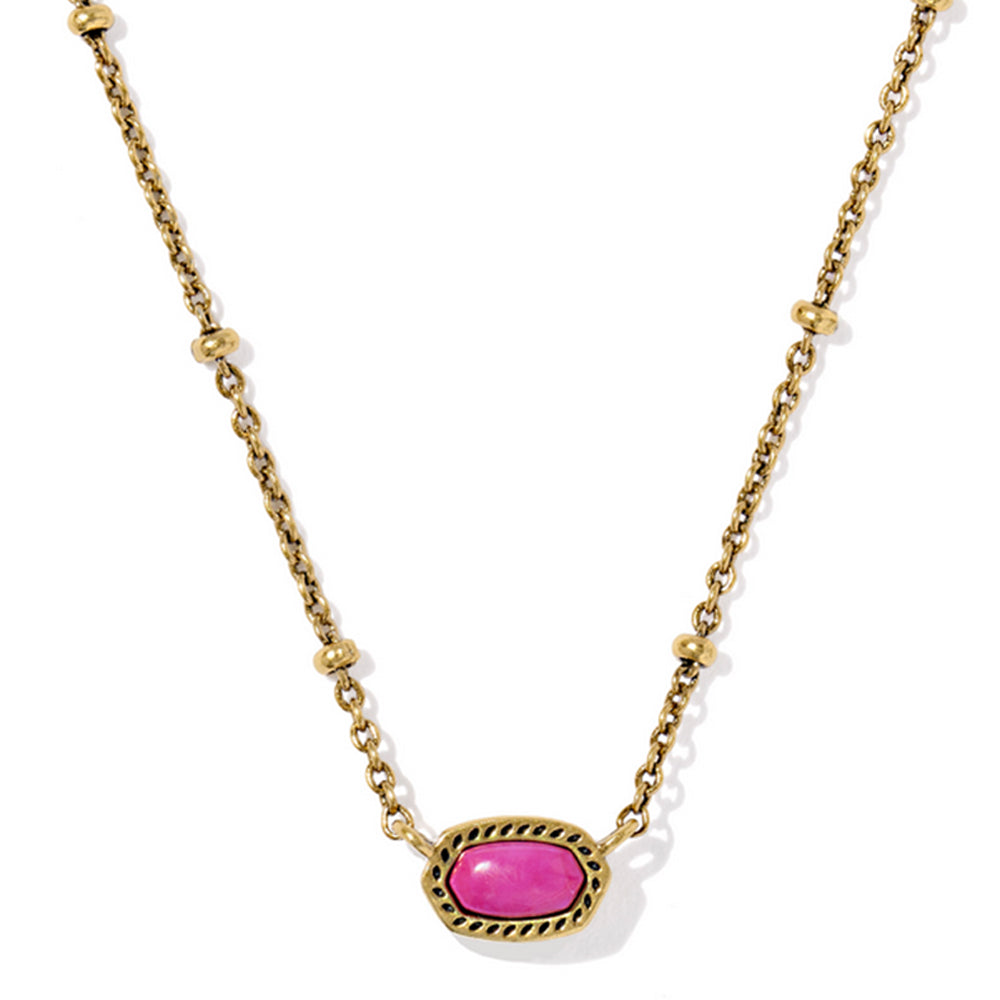 Gold necklace with a pink gemstone on a white background