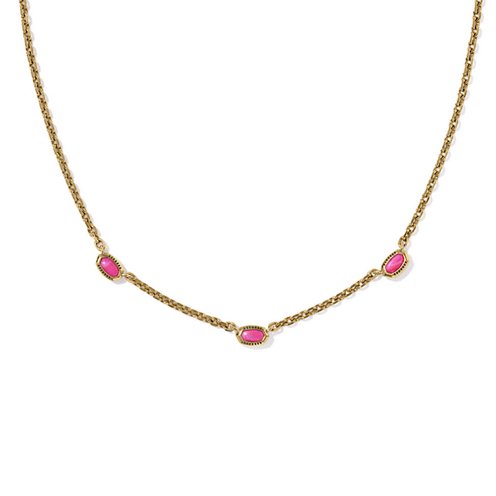 Gold necklace with pink stones on a white background