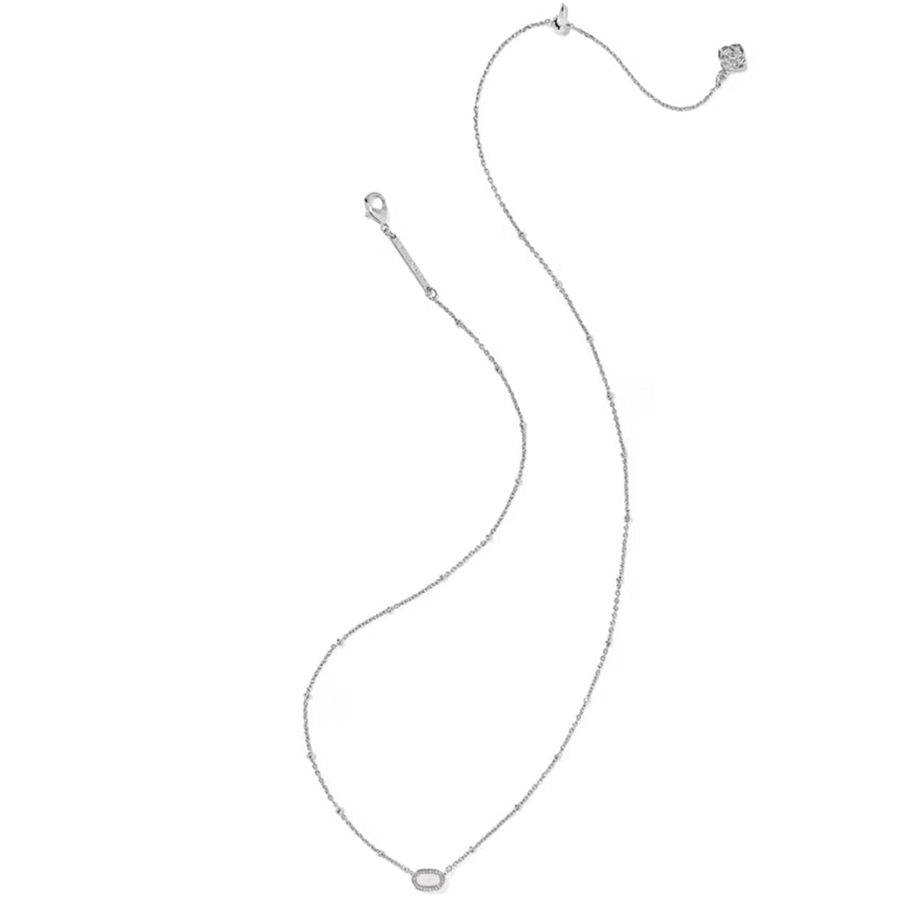 A delicate silver chain necklace with a small oval bezel-set clear gemstone pendant, displayed on a solid white background.