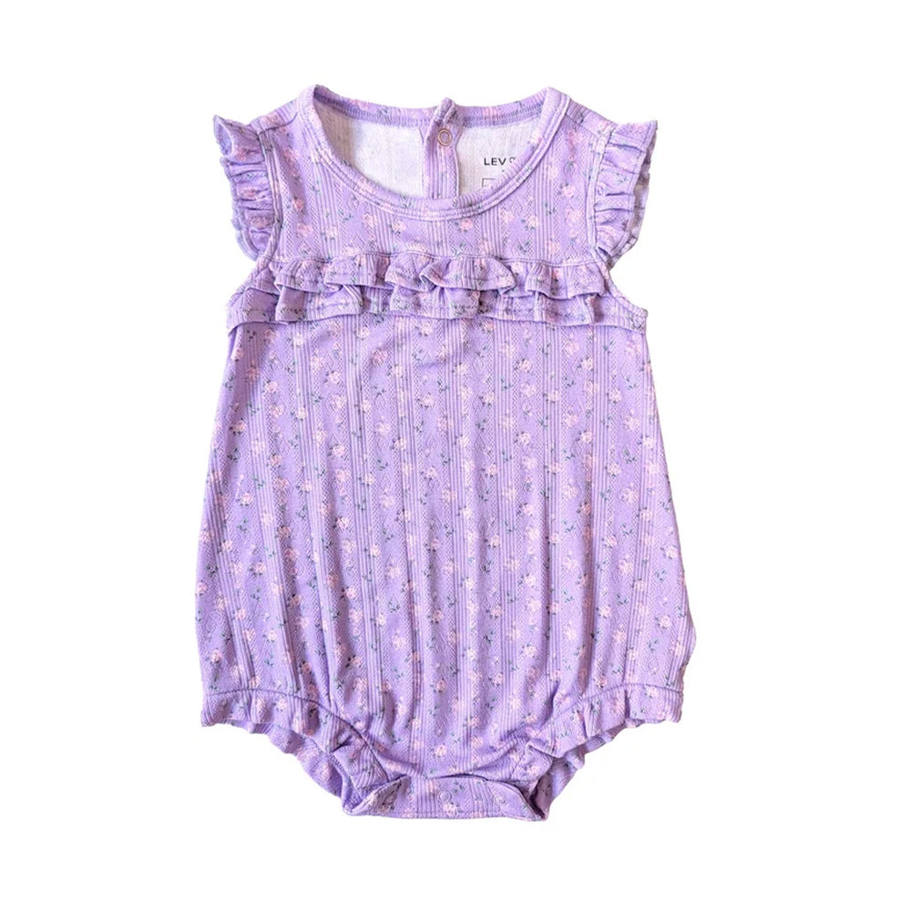 A lavender baby romper with a small floral print, featuring ruffle trim at the neckline and sleeve hems, laid flat on a white background.