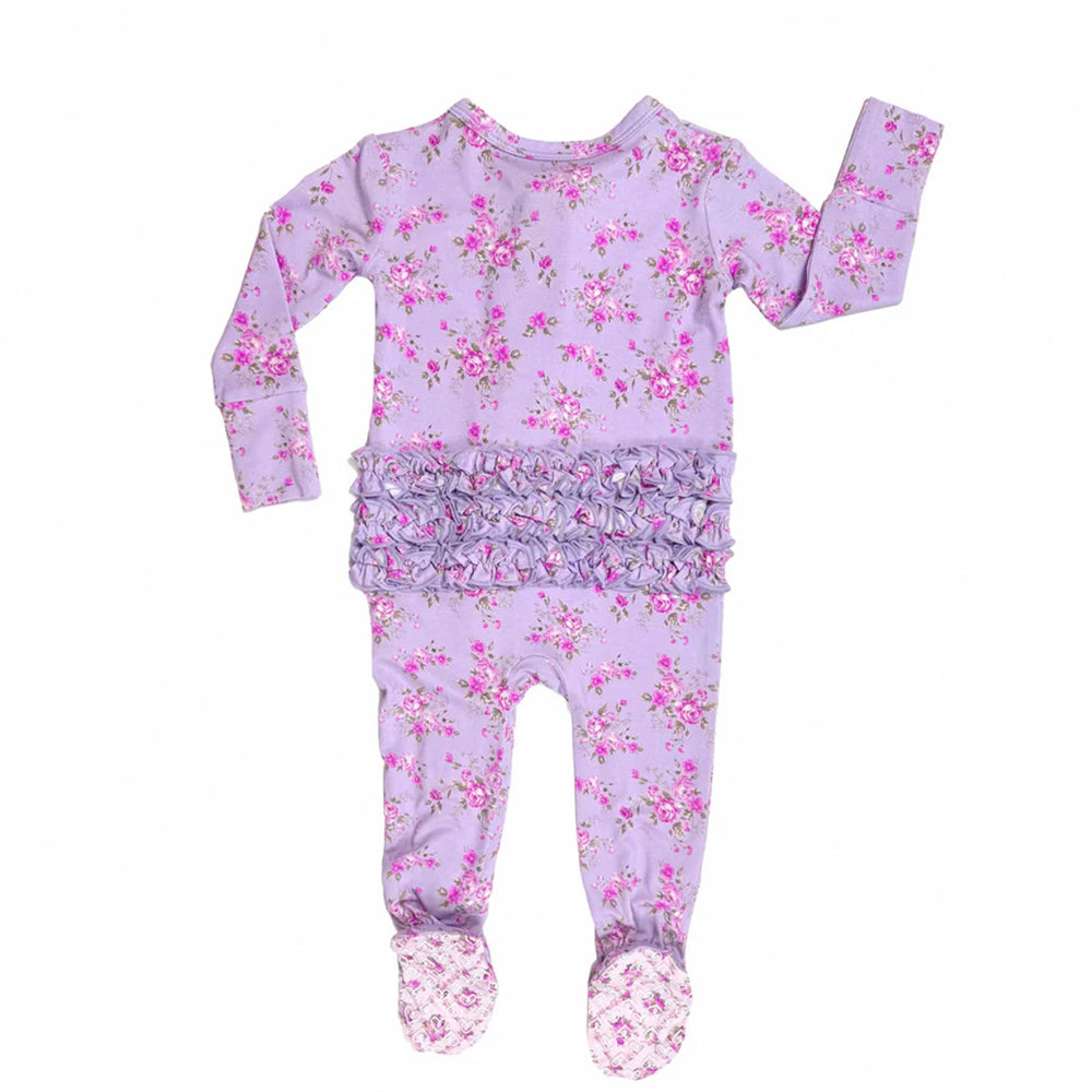Floral baby outfit with top and footed pants on a white background