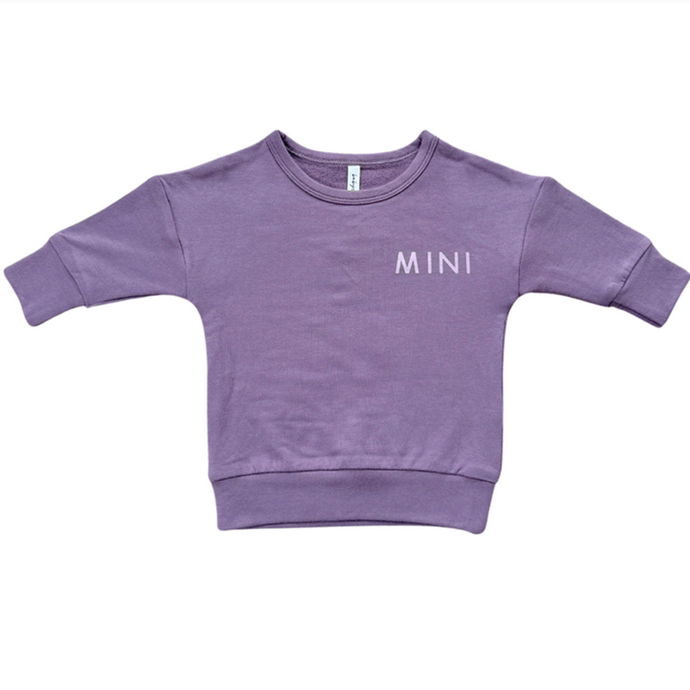 Purple sweatshirt with 'MINI' text on a white background