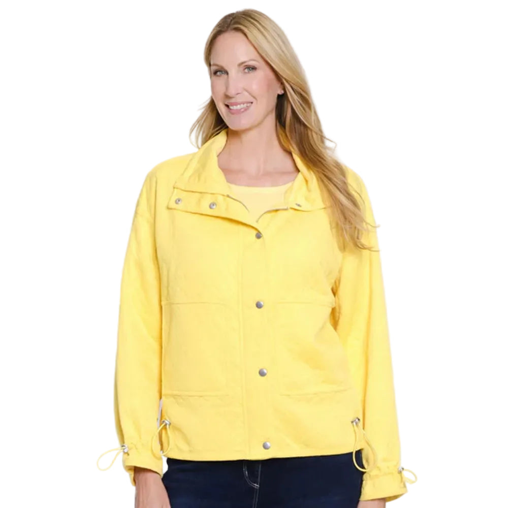 Woman wearing a yellow jacket on a white background