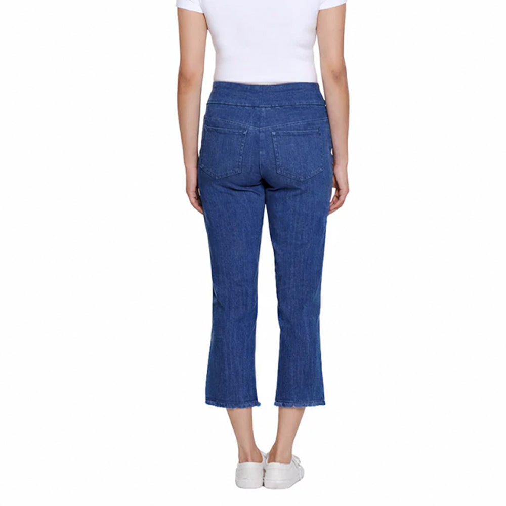 Person wearing blue jeans on a white background