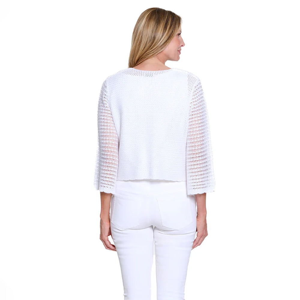 Woman wearing a white outfit with mesh sleeves on a white background