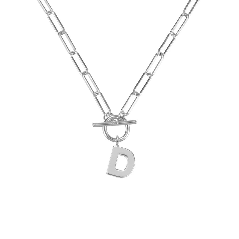 Silver necklace with a toggle clasp and 'D' charm on a white background