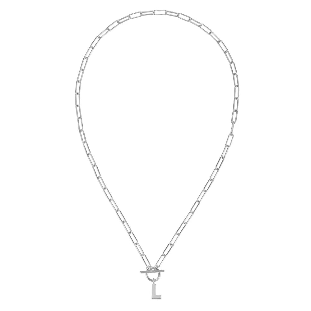Silver chain necklace with a key pendant on a white background