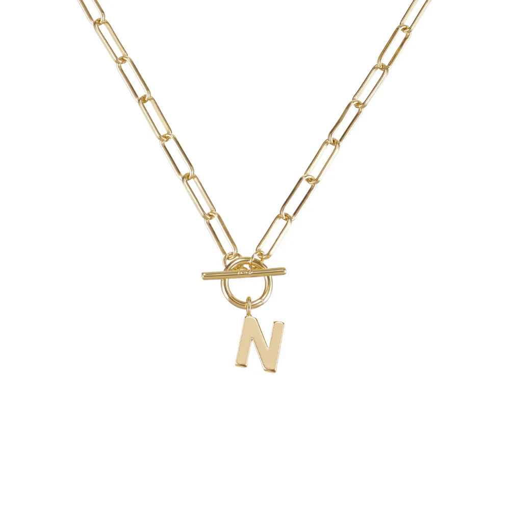 Gold necklace with a 'N' pendant on a white background