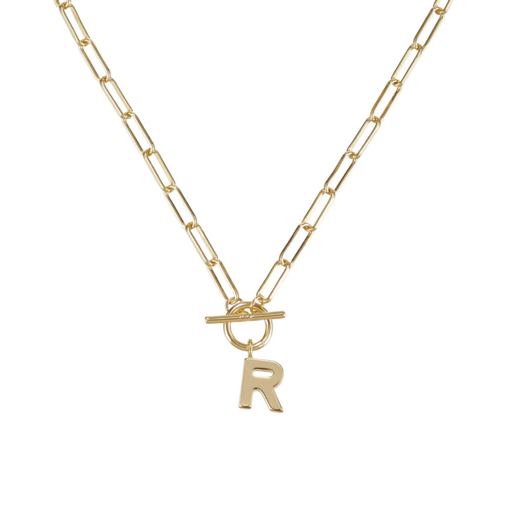 Gold necklace with a letter 'R' pendant on a white background