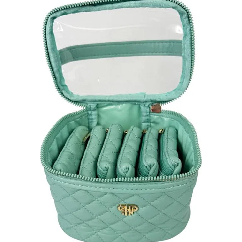 Mint green jewelry case with quilted design and clear top compartment on a white background