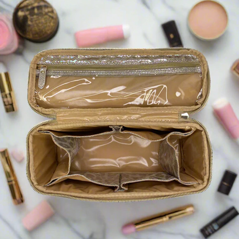 Open beige makeup bag with cosmetic items on a marble background