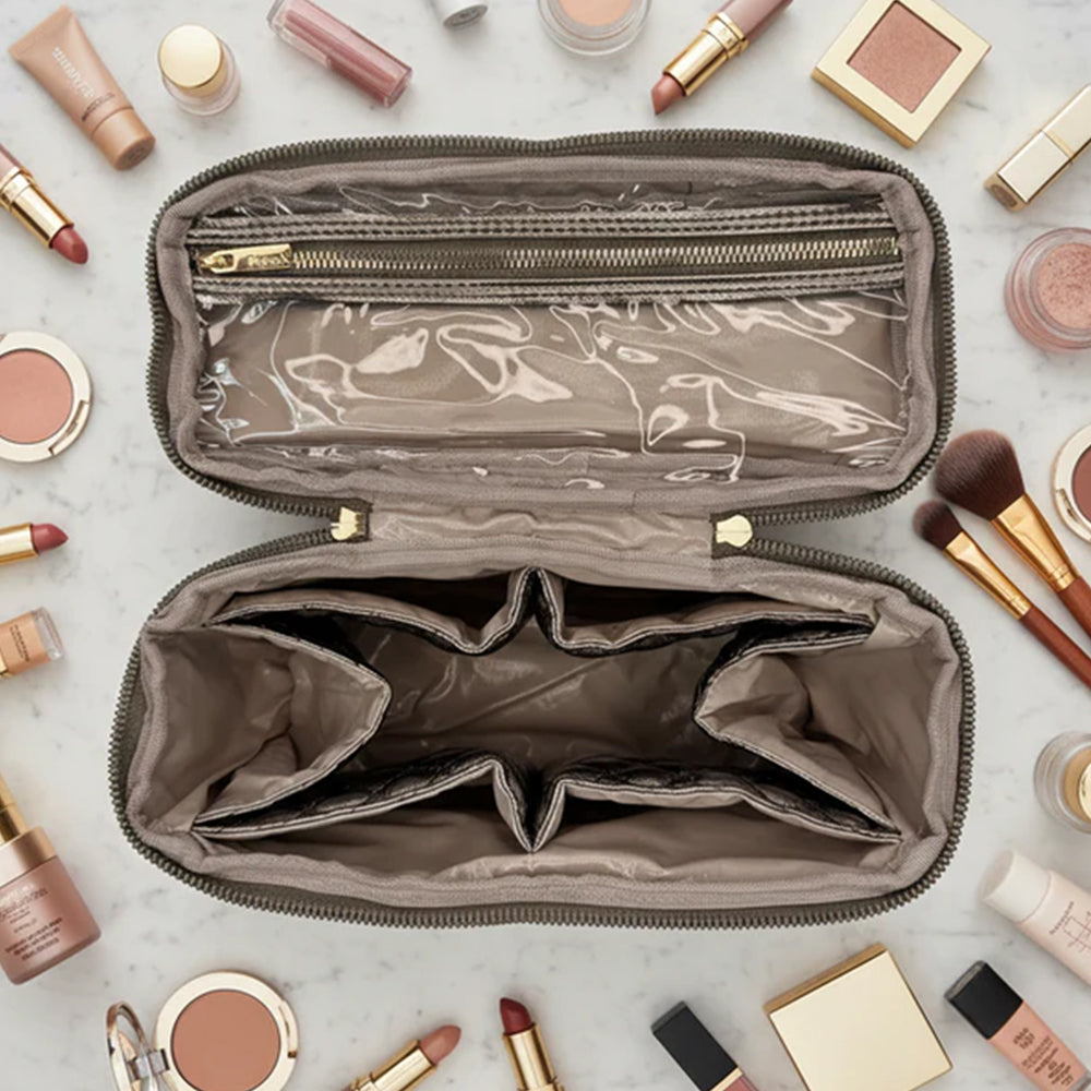 Open makeup bag with cosmetic products on a light surface