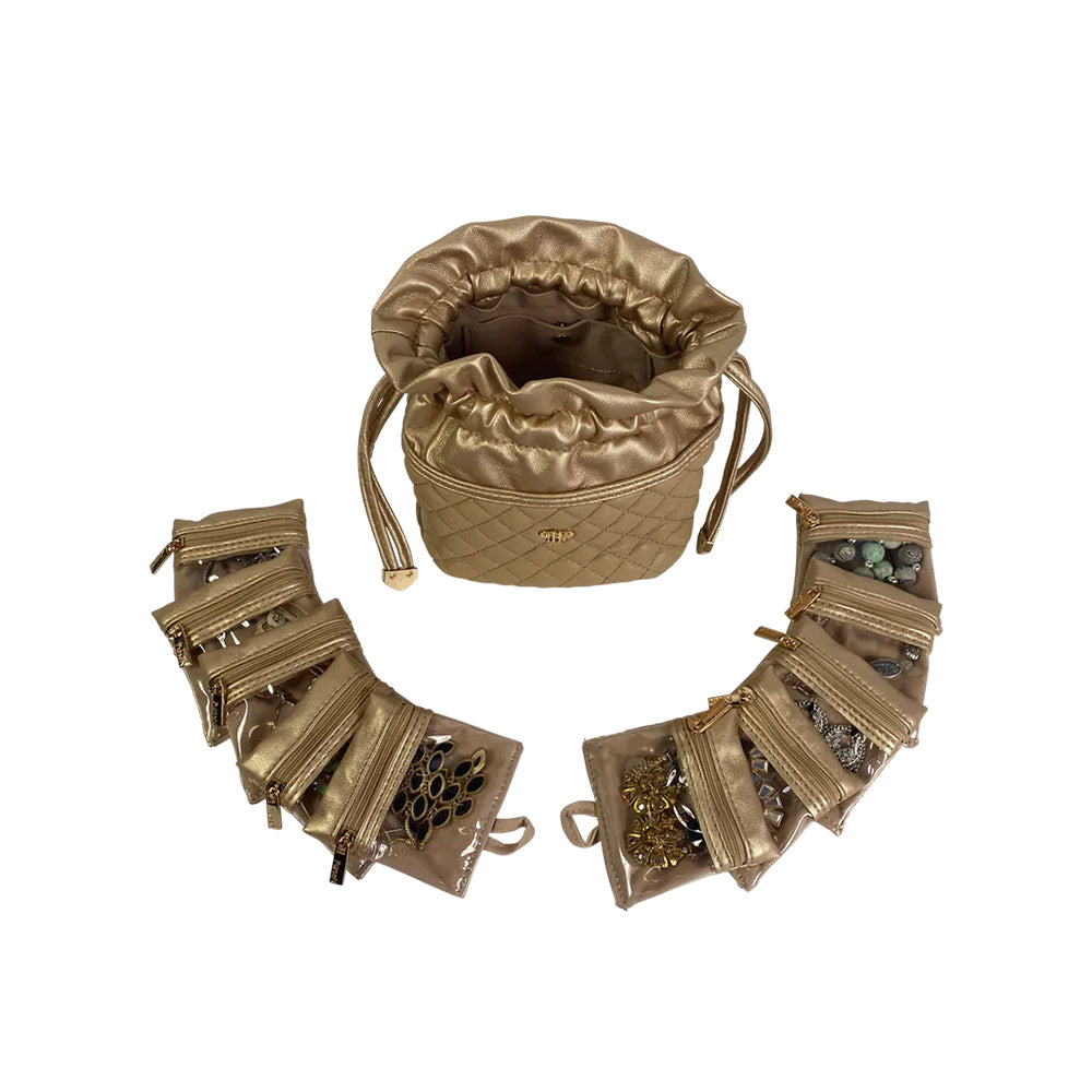 Gold jewelry set with a drawstring bag on a white background