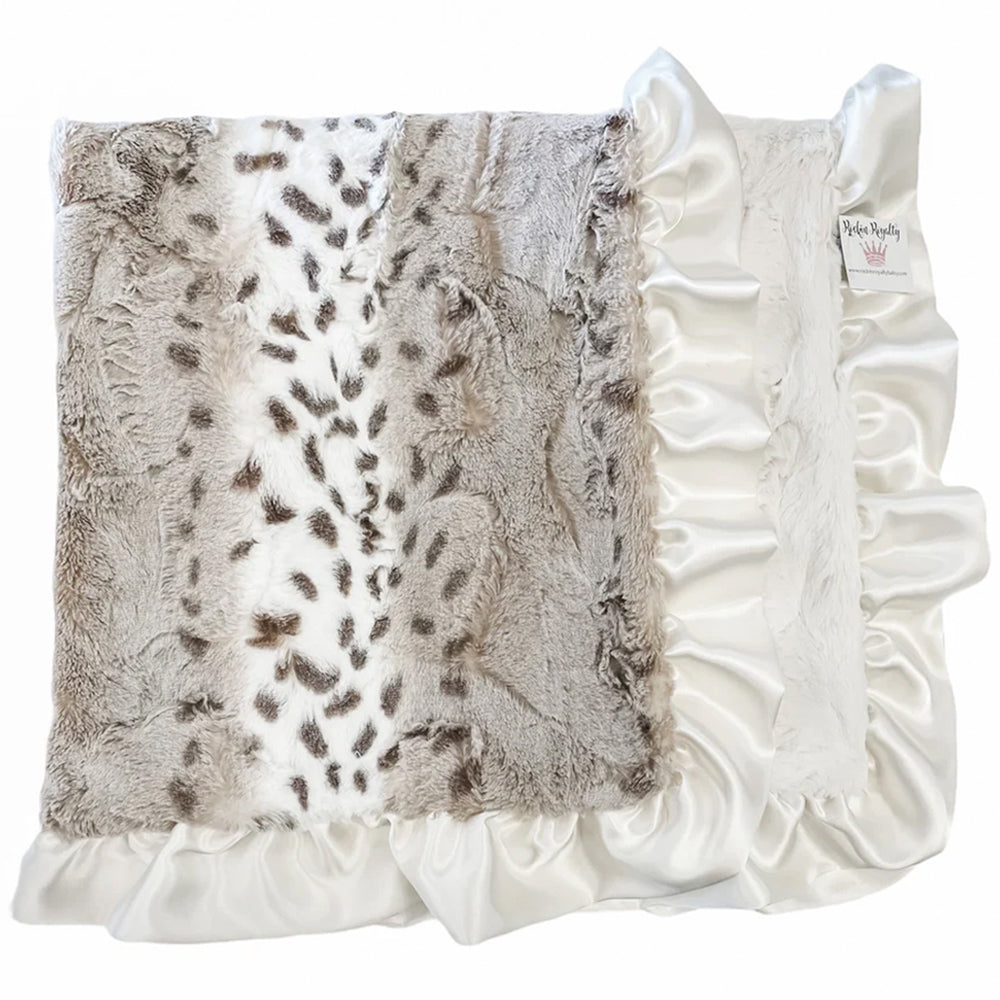 Decorative pillow with faux fur and ruffle trim on a white background