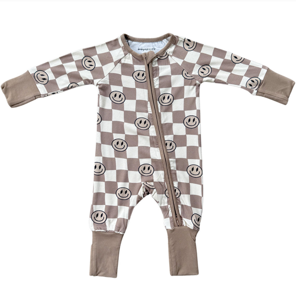 Baby romper with checkered pattern and smiley faces on a white background