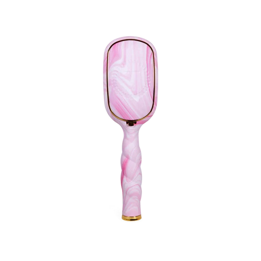 A pink and white marbled handheld mirror with a twisted handle and gold trim, shown against a plain white background.