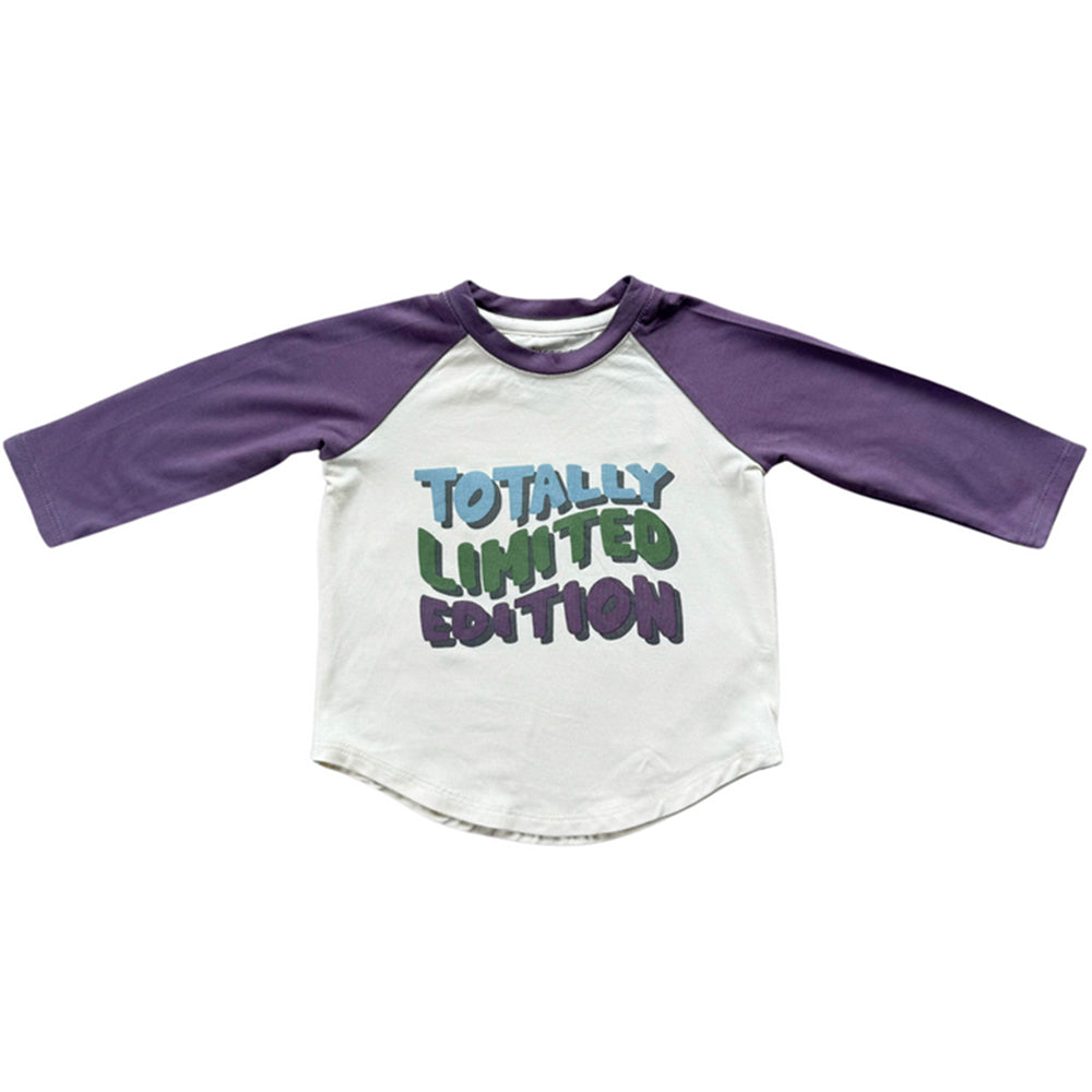 Children's shirt with purple sleeves and colorful text on a white background