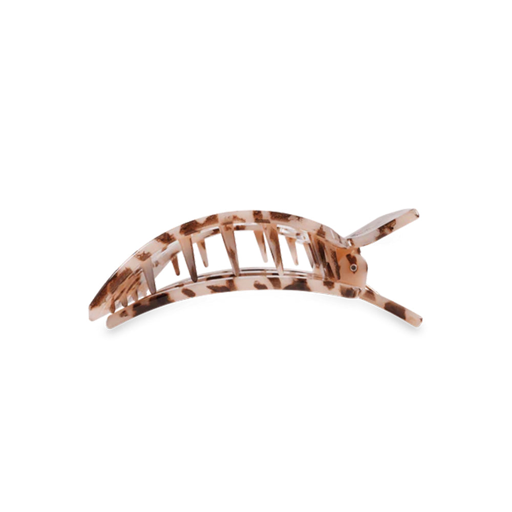 Tortoiseshell patterned hair clip on a white background