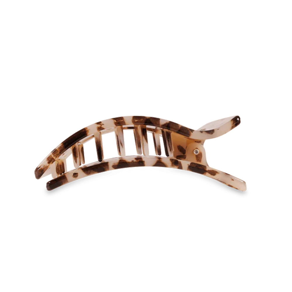 Tortoiseshell patterned hair clip on a white background