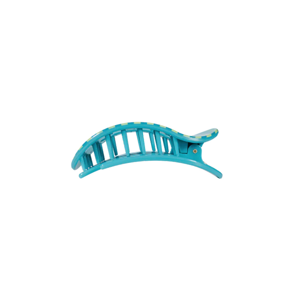 Turquoise hair clip on a white background