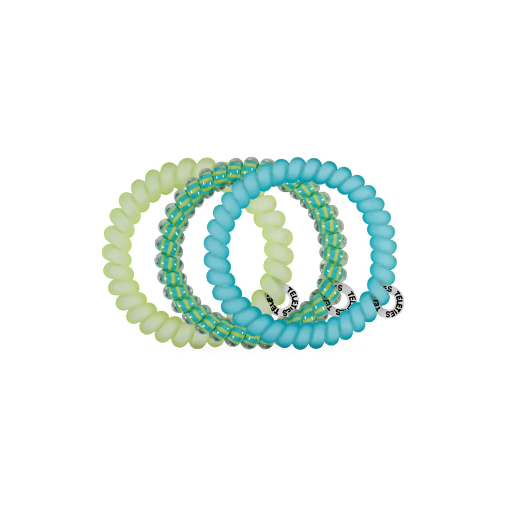 Set of three hair ties in green and blue on a white background