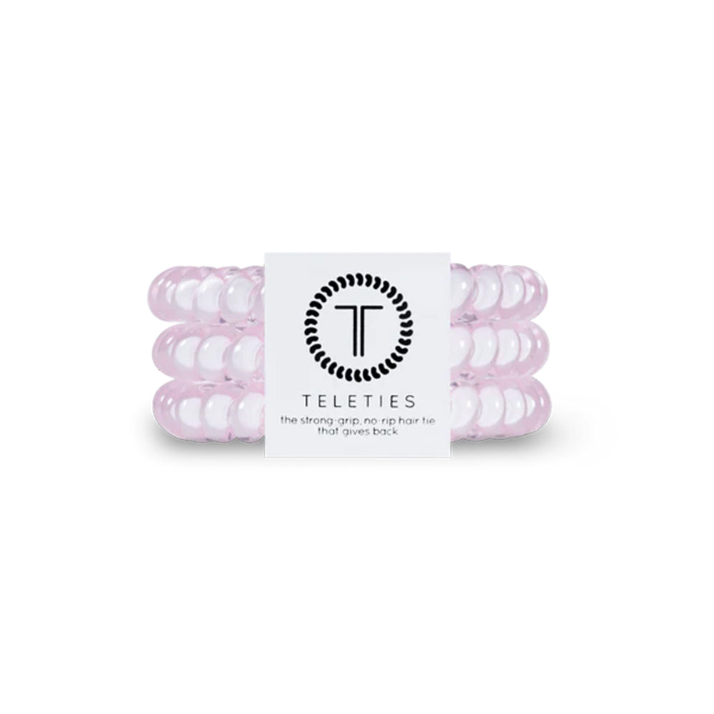 Pink hair ties with a Teleties label on a white background