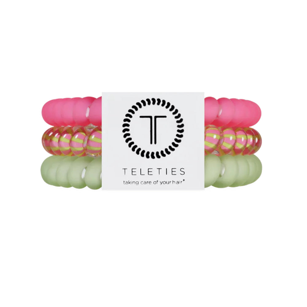 Set of colorful hair ties with a Teleties branded card on a white background