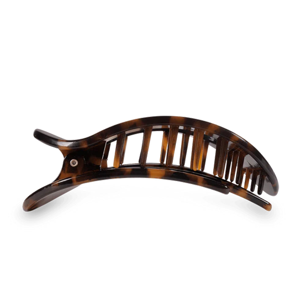 Brown tortoiseshell hair comb on a white background
