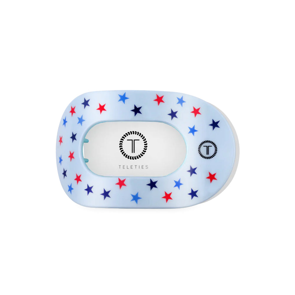 Teleties hair clip with star pattern on a white background
