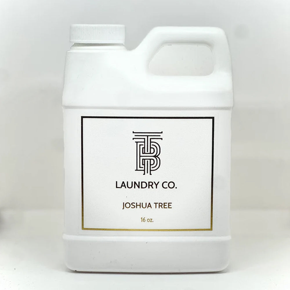 White laundry detergent container with 'Joshua Tree Laundry Co.' label on a white background