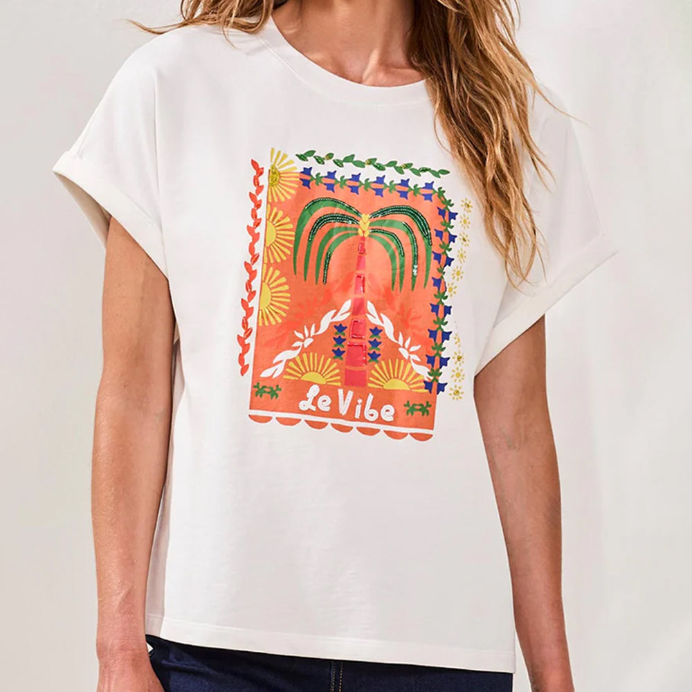 White t-shirt with colorful graphic design and 'Le Vibe' text on a plain background