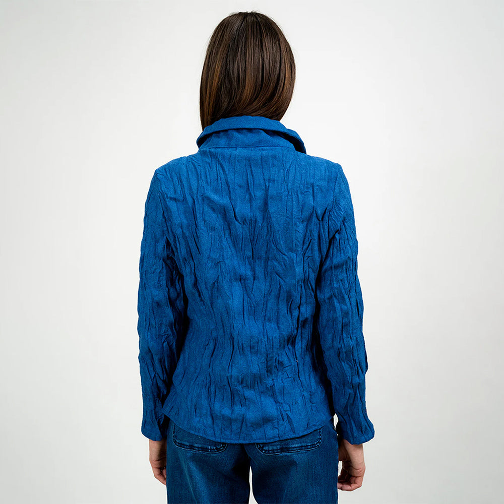 Person wearing a blue textured jacket on a white background