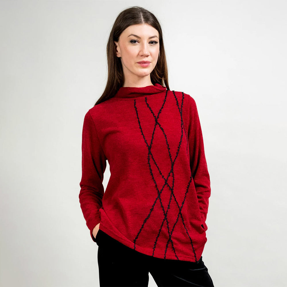 Woman wearing a red sweater with black pattern on a white background