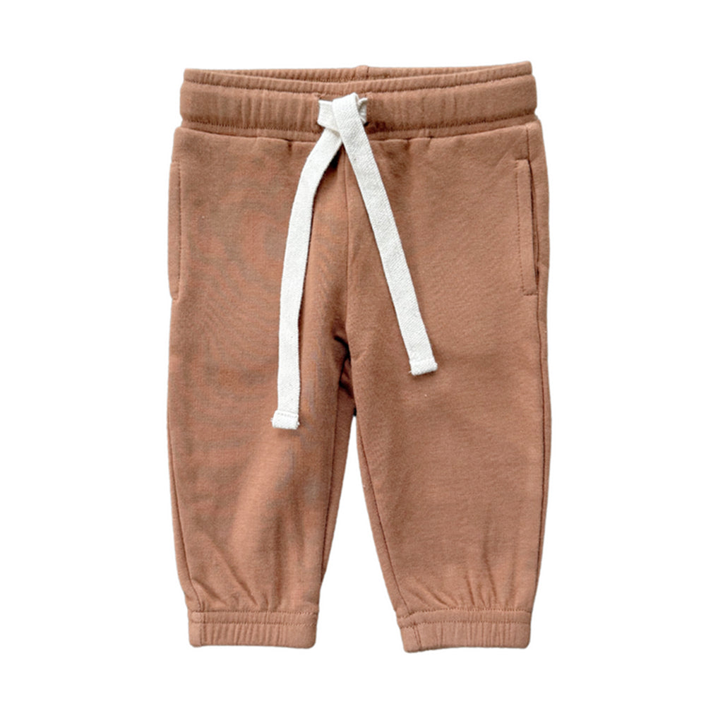 Brown sweatpants with a white drawstring on a white background