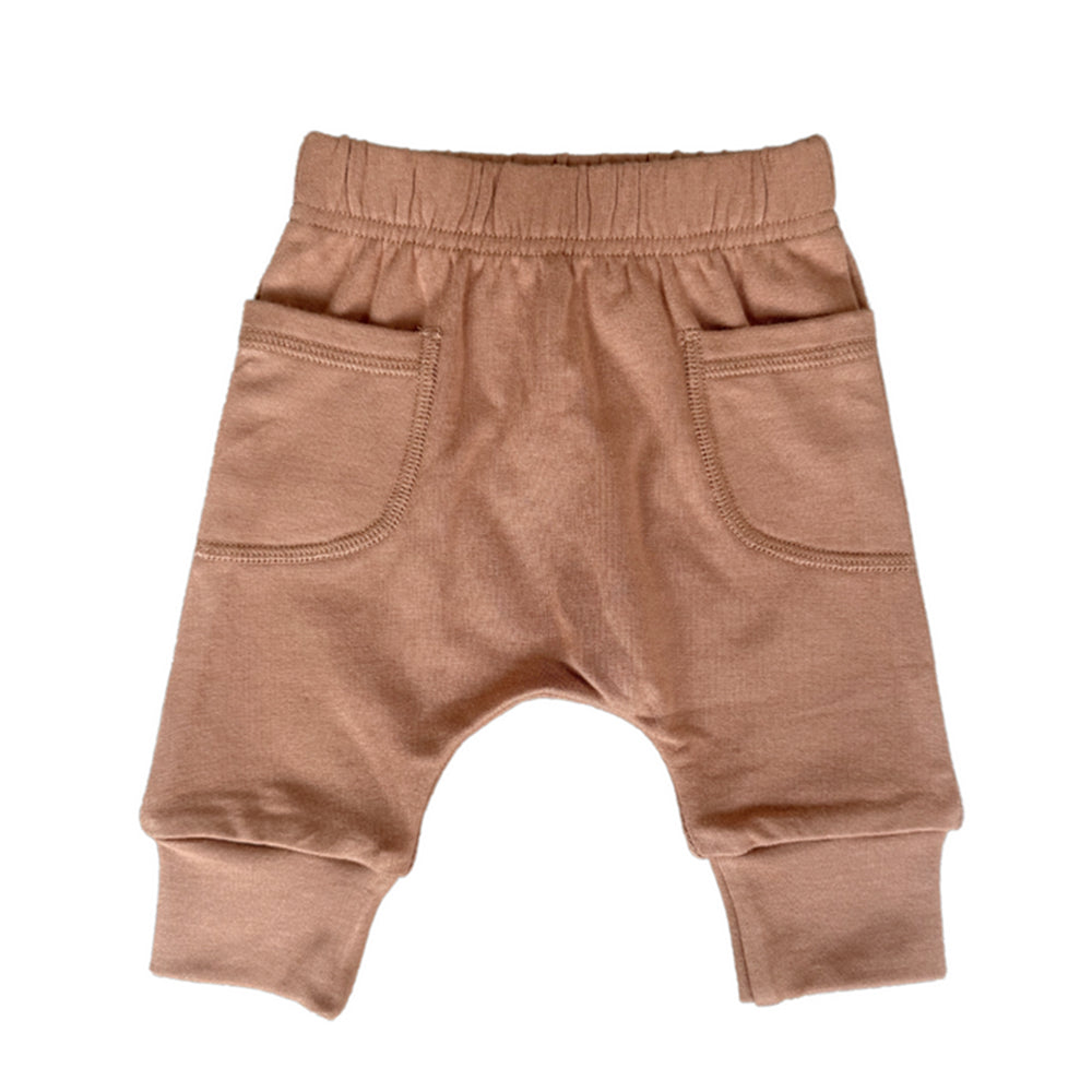 Brown baby pants on a white background
