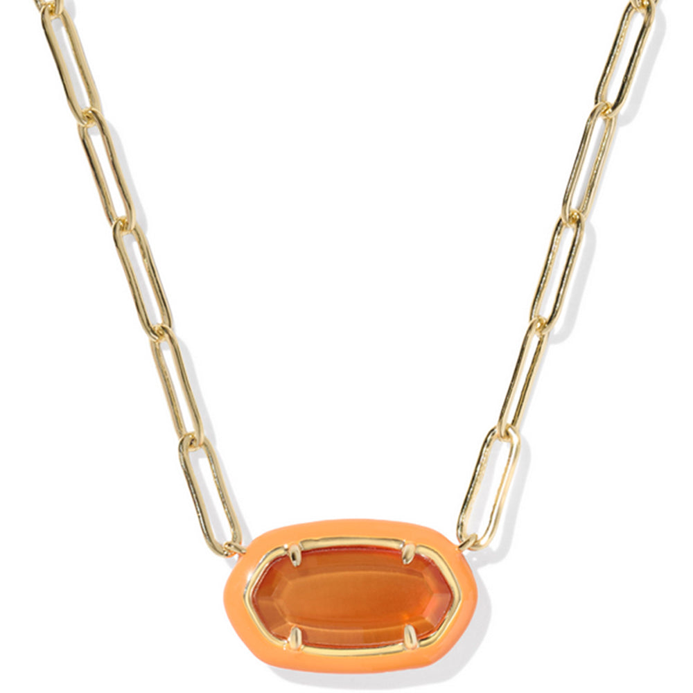 Necklace with an orange pendant on a gold chain against a white background