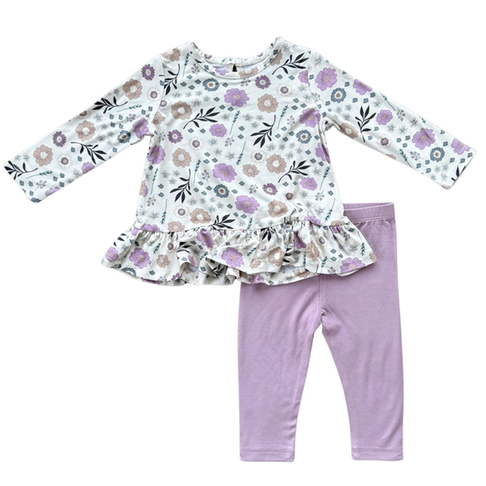 Children's floral top and purple leggings set on a white background