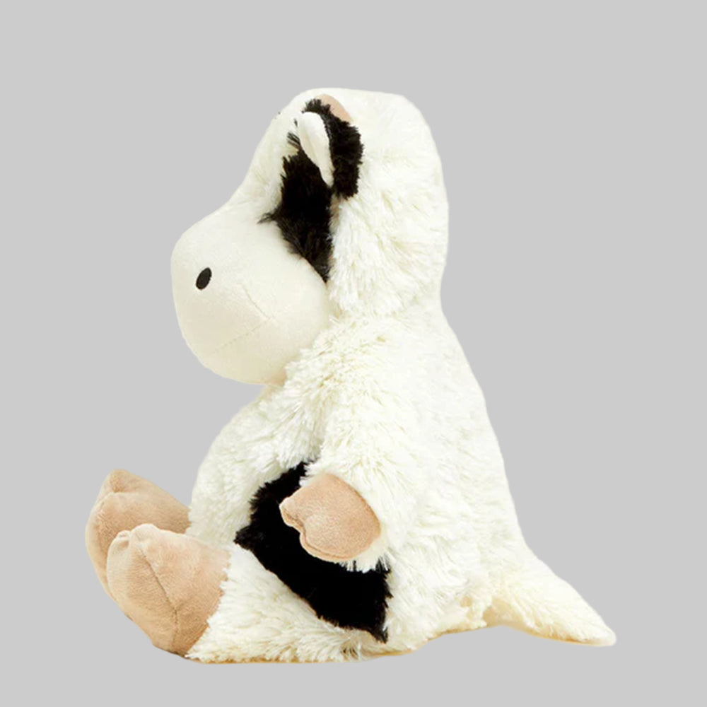 White plush toy with black accents on a light gray background