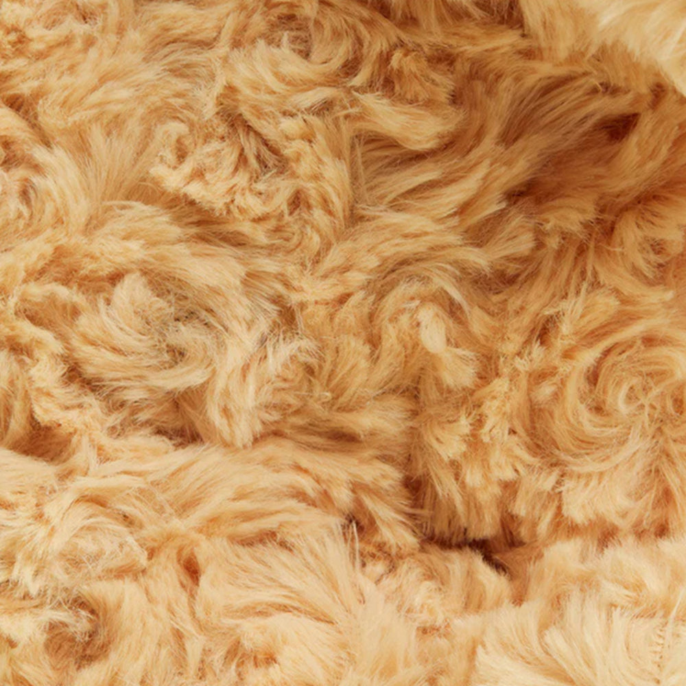 Close-up of beige fluffy fabric texture