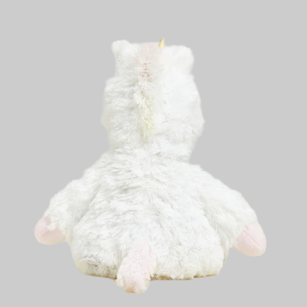 white plush unicorn with gray background