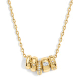 Gold necklace with interlocking rings and small diamonds on a white background