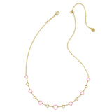 Gold necklace with pink heart-shaped beads on a white background