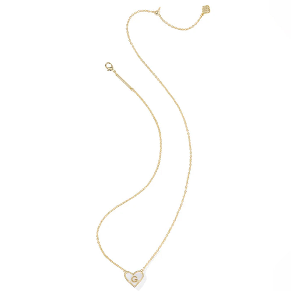 Gold necklace with a heart-shaped pendant on a white background